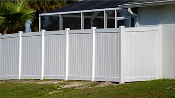 White vinyl fence installation by Fence Man Fencing.